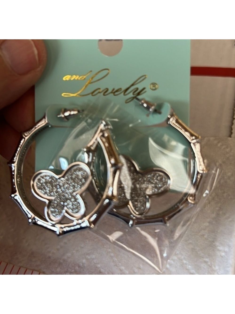 And Lovely Earrings, Silver Tone, hoop with butterfly, 1.5” Diameter
